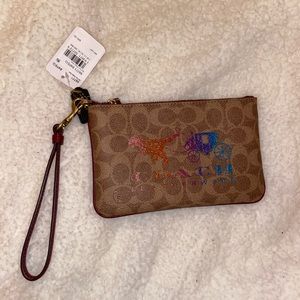 Limited Edition Rexy by Coach Wristlet
